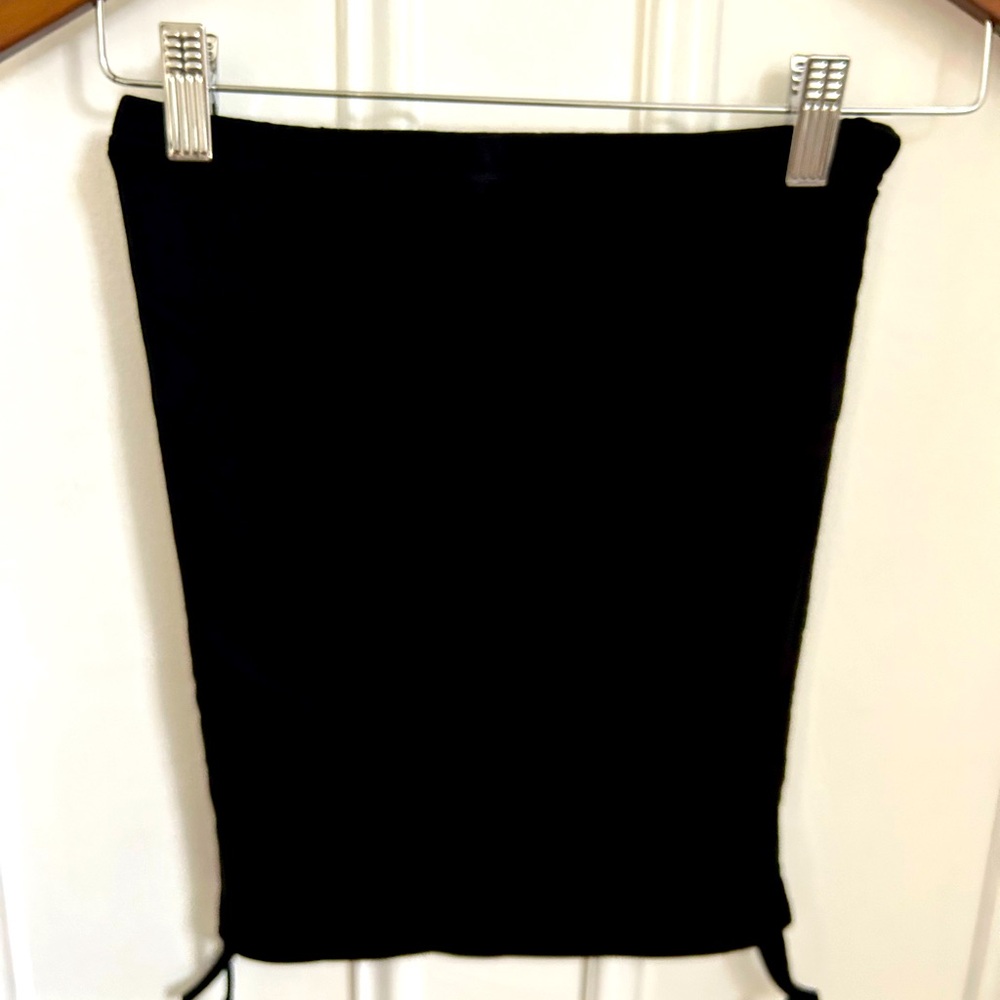 Tube top. Size M. New. With cute ties at the bottom